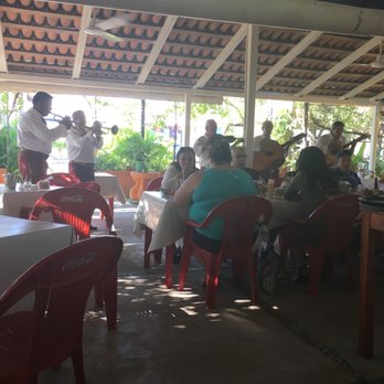 Mauricio's - Mariachi will come around to ask if you would like a song played. About $100 pesos per song. - Seafood Near Me - Las Juntas, JAL