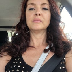 My hair after - shoulder length, dark auburn and curled like a barbie doll! NOT HAPPY!
