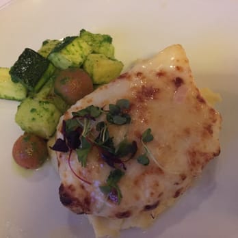 Spaghettini - Chilean Sea Bass with Garlic Mashed Potatoes and Pesto Squash and Tomatoes - Italian Near Me - Seal Beach, California Spaghettini - Chilean Sea Bass with Garlic Mashed Potatoes and Pesto Squash and Tomatoes - Italian Near Me - Seal Beach, California