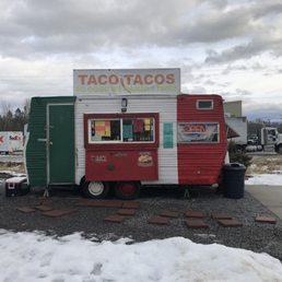 a taco truck parked in a parking lot