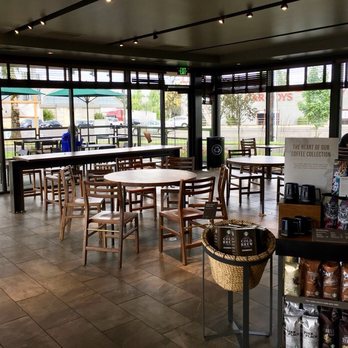 Starbucks - Seating area surrounded by floor-to-ceiling windows. - Coffee & Tea Near Me - Tigard, Oregon