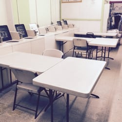 Norge Laundry and Dry Cleaning - Speed Queen commercial coin-op top loader washers and folding tables with seats