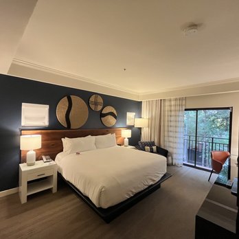 Amara Resort and Spa - King size bed and view of patio in room - Resorts Near Me - Sedona, Arizona Amara Resort and Spa - King size bed and view of patio in room - Resorts Near Me - Sedona, Arizona