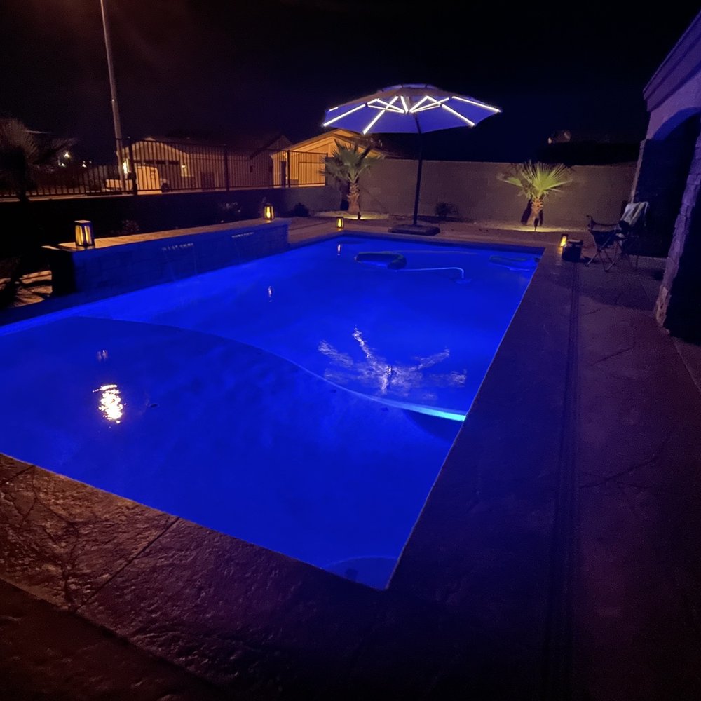 Aquatic Pools & Landscape - a pool lit up at night - General Contractors Near Me - Fort Mohave, Arizona