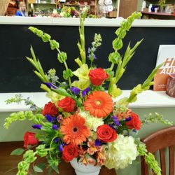 Talk Of The Town Floral Boutique - Large, fun colorful mix with glads, bells, gerberas, roses, hydrangeas, iris and alstromeria.