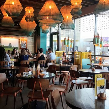 Nando's Peri-Peri - Seating Area at Nando's Peri-Peri in Oakbrook Center - South African Near Me - Oakbrook, Illinois Nando's Peri-Peri - Seating Area at Nando's Peri-Peri in Oakbrook Center - South African Near Me - Oakbrook, Illinois