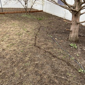 Nature’s Touch Landscaping - Before-bed with no edging or mulch. - Landscaping Near Me