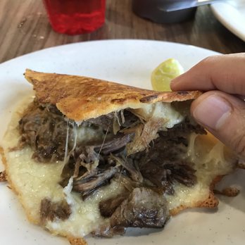 Aqui Es Texcoco - Lamb Quesataco inside, the cheese is the shell - Mexican Near Me - Chula Vista, California