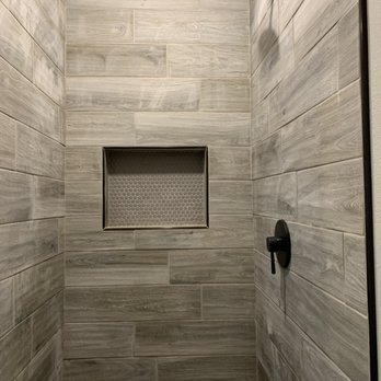 SG Construction - a walk in shower with a shower head - General Contractors Near Me - Victoria, Texas SG Construction - a walk in shower with a shower head - General Contractors Near Me - Victoria, Texas