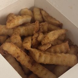Fryer grease so old and dirty. Fries covered in burnt black specks.