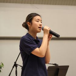 Rochester Academy of Music - Voice lesson student singing at the recital of Rochester Academy of Music