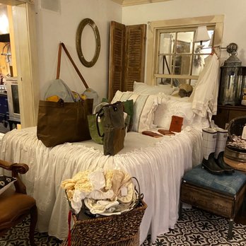 Blue Pig Bakery - a bed with white sheets and a basket of clothes - Bakeries Near Me - Newport, Oregon Blue Pig Bakery - a bed with white sheets and a basket of clothes - Bakeries Near Me - Newport, Oregon