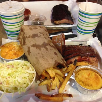 Smoque BBQ - Brisket Platter with Coleslaw, French Fries, Mac & Cheese, and Cornbread (Baby Back Ribs 1/2 Slab in the background) - Barbeque Near Me - Chicago, Illinois Smoque BBQ - Brisket Platter with Coleslaw, French Fries, Mac & Cheese, and Cornbread (Baby Back Ribs 1/2 Slab in the background) - Barbeque Near Me - Chicago, Illinois
