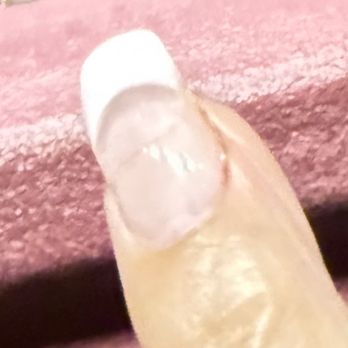 Golden Nail&SPA - "Fixed" nail. You can kind of see where she drilled too deep on the right side of my finger. - Nail Salons Near Me - New York, New York