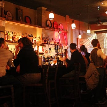 The Fulton Grand - a group of people sitting at a bar - Bars Near Me - Brooklyn, New York The Fulton Grand - a group of people sitting at a bar - Bars Near Me - Brooklyn, New York