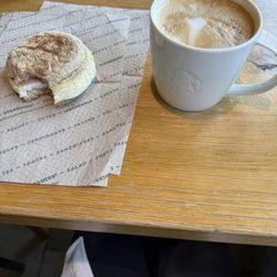 Starbucks - Tall flat white w low cal sandwich of turkey bacon, egg white and gouda on whole wheat muffin. 230 cals