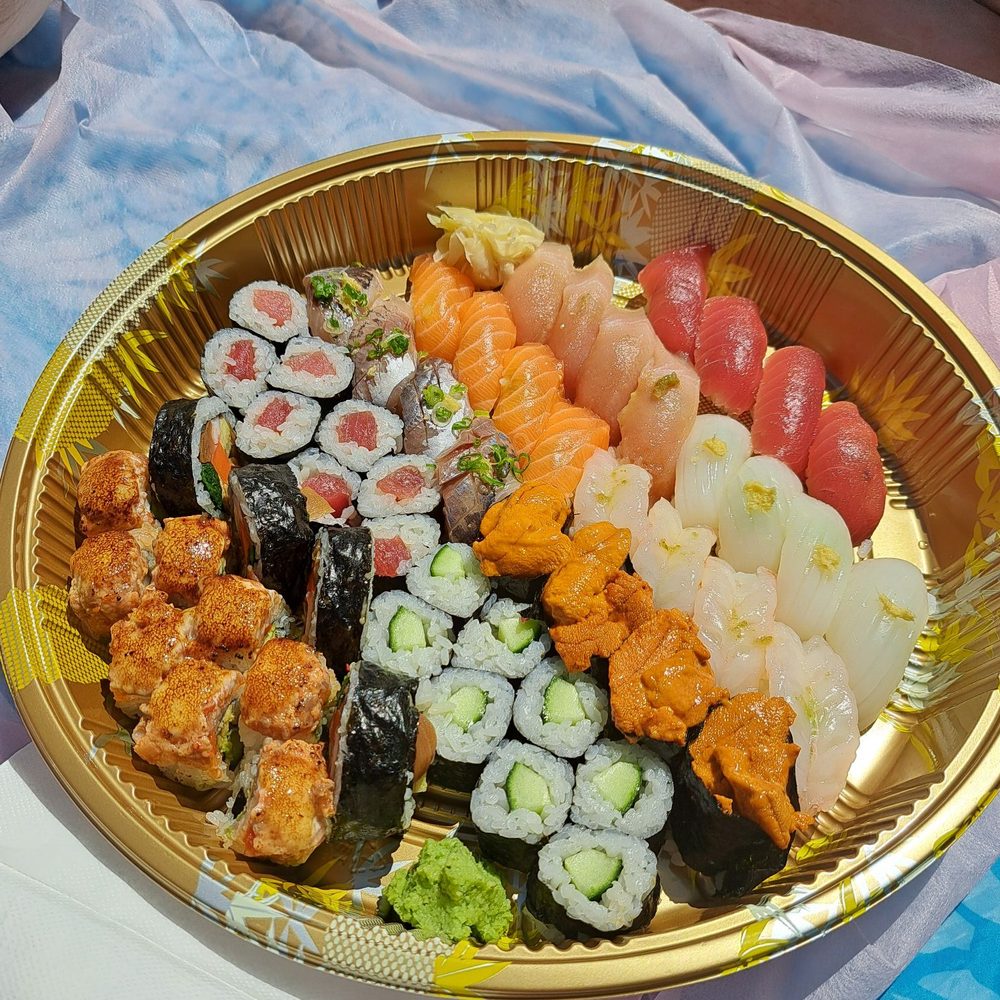 Sushi Party Tray ($85). For 4 people, includes Chef's choice nigiri and rolls Sushi Party Tray ($85). For 4 people, includes Chef's choice nigiri and rolls