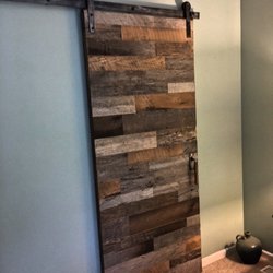 Quality Design Renovations - Amish made reclaimed wood barn door on Rustica Hardware track on a repeat customer's master bathroom.