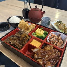 Takoyaki  Bento w/ Gyudon, pork katsu, squid salad, sweet potato tempura.