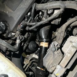 Ken's Auto Repair - what spending over 500$ looks like. A bootlegged hose made with pvc pipe spray painted black.Gotta love a honest mechanic.