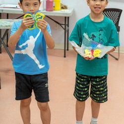 Art One Academy - Richmond Hill - Our Art Combo 2 boys showing their clay sculpture butterflies