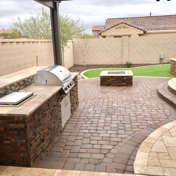 Pristine Landscaping - an outdoor kitchen with a grill - Landscaping Near Me - Peoria, Arizona Pristine Landscaping - an outdoor kitchen with a grill - Landscaping Near Me - Peoria, Arizona