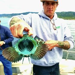 Hooked On Mendo Charters - The Capt. holding a beautiful colored Ling Cod!
