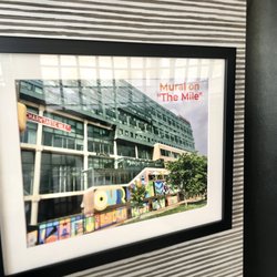Visit Baltimore - The 'Our Baltimore' Mural Art framed on The "Charm'tastic Mile" in lobby of Renaissance Harborplace Hotel.