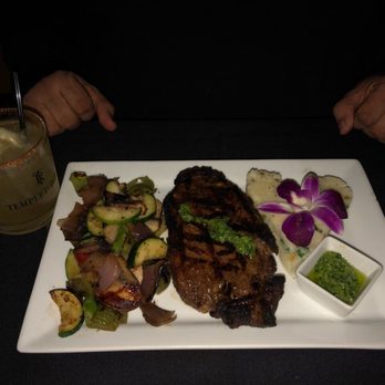 Penumbra - New York Strip Steak seasoned with roasted garlic peppercorn. - Wine Bars Near Me - Chicago, Illinois