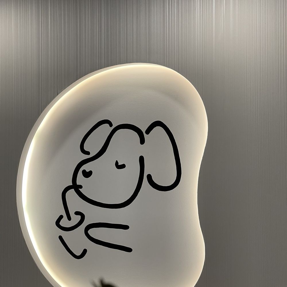 Machi Machi - a drawing of a dog on a plate - Bubble Tea Near Me - Montreal, Quebec
