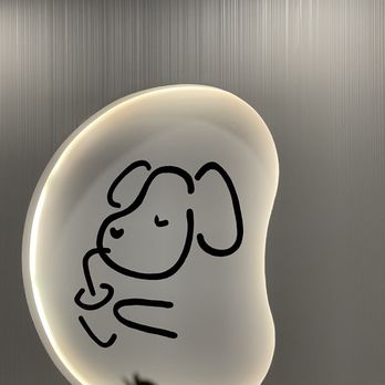 Machi Machi - a drawing of a dog on a plate - Bubble Tea Near Me - Montreal, Quebec