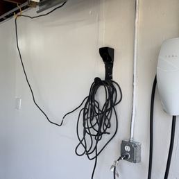 They installed the charger on the right side which was routed to the back panel of the house 120 ft away. They installed the charger on the right side which was routed to the back panel of the house 120 ft away.