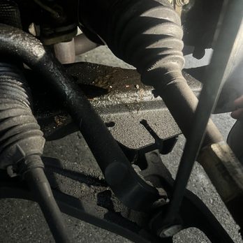 Brake Masters - Just below the boot.. caked in oil everywhere.. - Auto Repair Near Me - Lake Forest, California Brake Masters - Just below the boot.. caked in oil everywhere.. - Auto Repair Near Me - Lake Forest, California