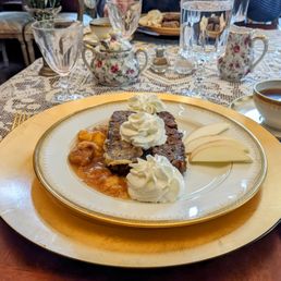 Breakfast at Buffalo Harmony House - French toast on homemade zucchini nut bread, peach compote, apples & whipped cream.