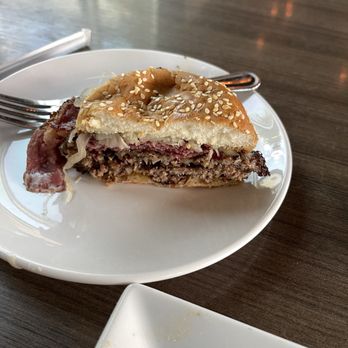 Firepit Pizza Tavern - 'The New Yorker' Burger - 2 Beef smash patties on a seeded bun with pastrami, Swiss cheese, sauerkraut, and Russian Dressing - Pizza Near Me - Atlanta, Georgia