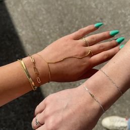 the hand chain and silver bracelet with the birthstone on it the hand chain and silver bracelet with the birthstone on it