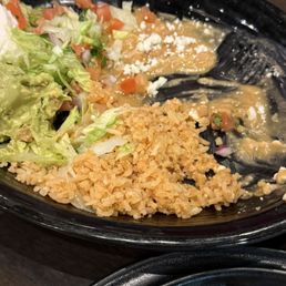 Side dish of beans, rice sour cream, and Guacamole. Comes with molcajete. Side dish of beans, rice sour cream, and Guacamole. Comes with molcajete.