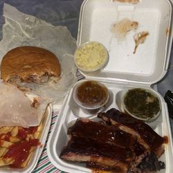 Johnson's Bar-B-Que - Barbecue ribs, collard greens, baked beans, potato salad, barbecue sandwich, side of fries, and coleslaw.  All for $25.00.
