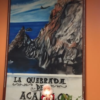 Taqueria La Quebrada De Acapulco - a painting of a santa claus sitting at a table - Mexican Near Me - Bensenville, Illinois Taqueria La Quebrada De Acapulco - a painting of a santa claus sitting at a table - Mexican Near Me - Bensenville, Illinois