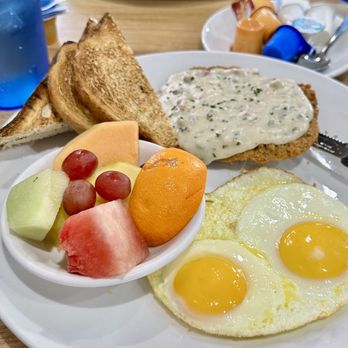 Broken Yolk Cafe - Chicken Fried Steak and Eggs. White toast and fruits - Breakfast & Brunch Near Me - La Verne, California