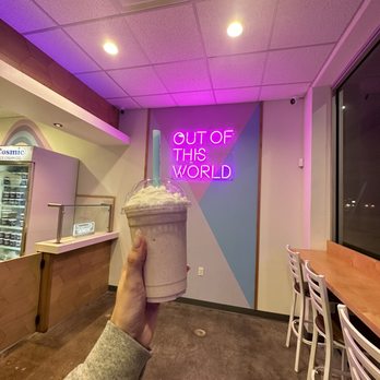 Cosmic Ice Cream -  hand holding a cup of ice cream - Ice Cream & Frozen Yogurt Near Me - Houston, Texas