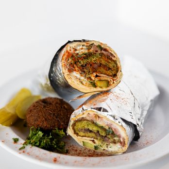 Sultan’s Restaurant - West Lansing - Get a load of our Falafel Wrap made with absolute love! - Mediterranean Near Me - Lansing, Michigan
