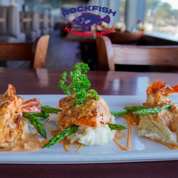 Rockfish Harbor Grill - Seafood Trio: jumbo prawns, sea scallops, fresh fish, roasted garlic mashed potatoes - Seafood Near Me - Monterey, California Rockfish Harbor Grill - Seafood Trio: jumbo prawns, sea scallops, fresh fish, roasted garlic mashed potatoes - Seafood Near Me - Monterey, California