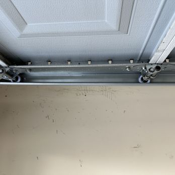 GDI Garage Doors - Newly installed rollers facing wall. - Garage Door Services Near Me