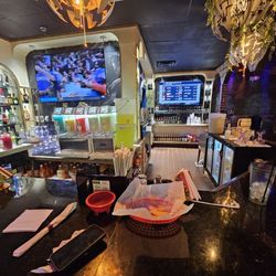 No bartender assigned to the bar. No one here to assist customers at the bar.