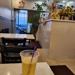 Pho Mi Viet Hoa - Sitting in the restaurant, looking out into the lot sipping on a cup of Iced tea....