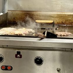 Johnnie's Hamburgers & Coneys - Burgers on the grill