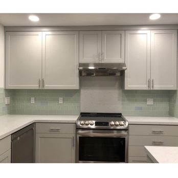 Katz Construction - a kitchen with white cabinets and stainless steel appliances - General Contractors Near Me - San Leandro, California Katz Construction - a kitchen with white cabinets and stainless steel appliances - General Contractors Near Me - San Leandro, California