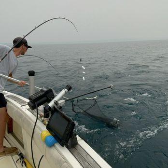 Mega-Bite Fishing Charters - Bringing in another one - Fishing Near Me - Traverse City, Michigan Mega-Bite Fishing Charters - Bringing in another one - Fishing Near Me - Traverse City, Michigan