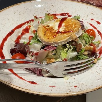 Nuria - Goat's Cheese Salad with raisins and walnuts. - Spanish Near Me - Barcelona, B Nuria - Goat's Cheese Salad with raisins and walnuts. - Spanish Near Me - Barcelona, B